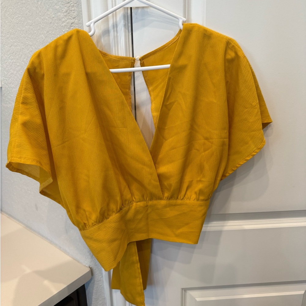 Yellow blouse that ties on the back